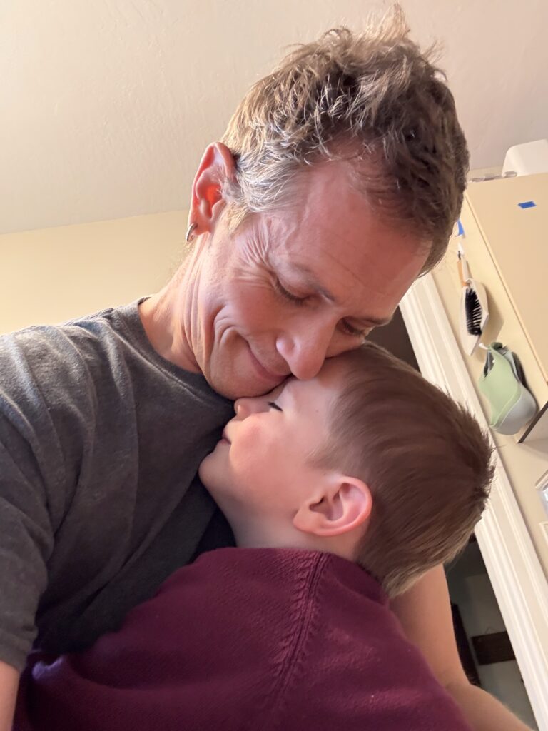 Reed and Locke share a full-on hug.