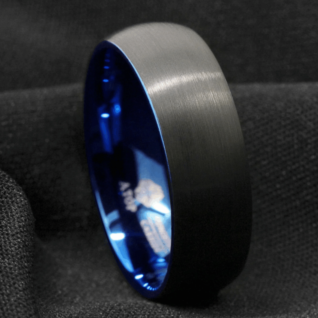 A dark grey ring with a cobalt blue inside that very slightly shows around the edge.